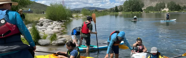 people on the river with sup's and boats