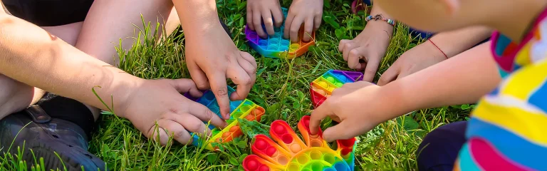 kids playing with toys in nature